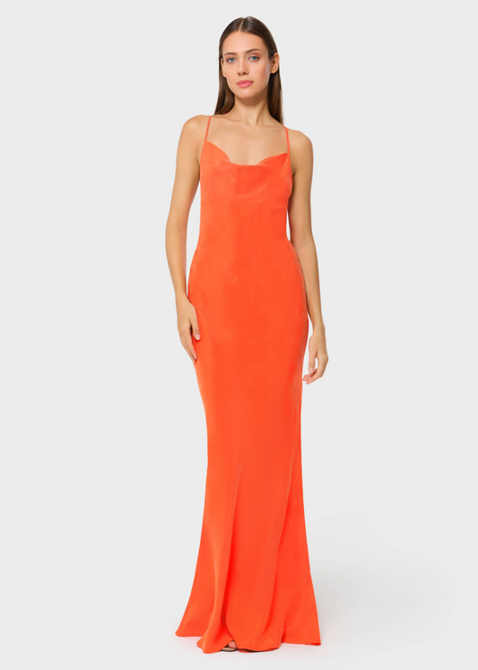 Woman wearing bright orange vegan silk slip maxi dress, front view