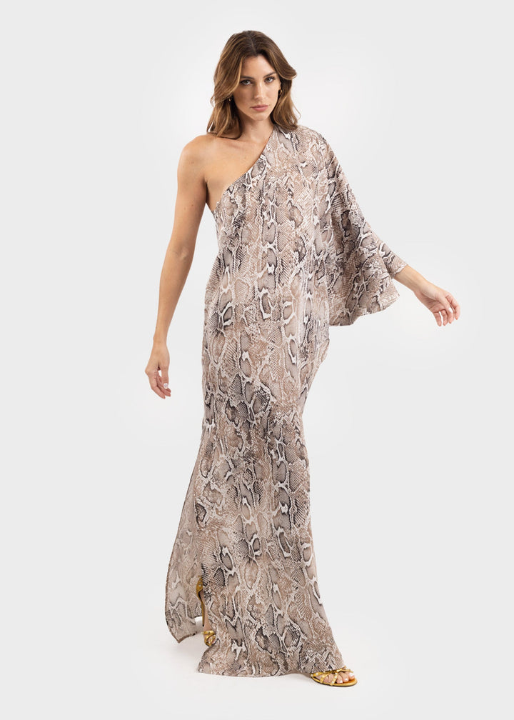 Woman wearing a gray and white snake print one-shoulder sleeveless maxi dress